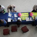 Job seekers inquire about jobs at the MasTec company booth during the Mega JobNewsUSA South Florida Job Fair held in the Amerant Bank Arena on September 25, 2025 in Sunrise, Florida. Hiring managers and recruiters attended the job fair to recruit workers for some of the positions businesses are trying to fill in Miami, Broward, and Palm Beach Counties.