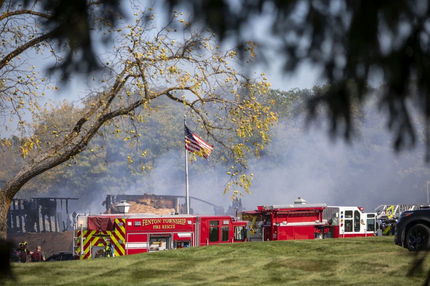 Emergency services respond Sunday to a shooting and fire at the chapel in Grand Blanc.