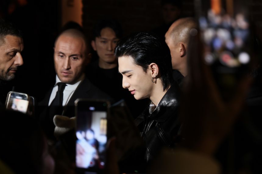 Rapper Hyunjin arriving at the Versace event, staged in a historical art gallery a stone's throw from Milan's renowned Duomo cathedral.