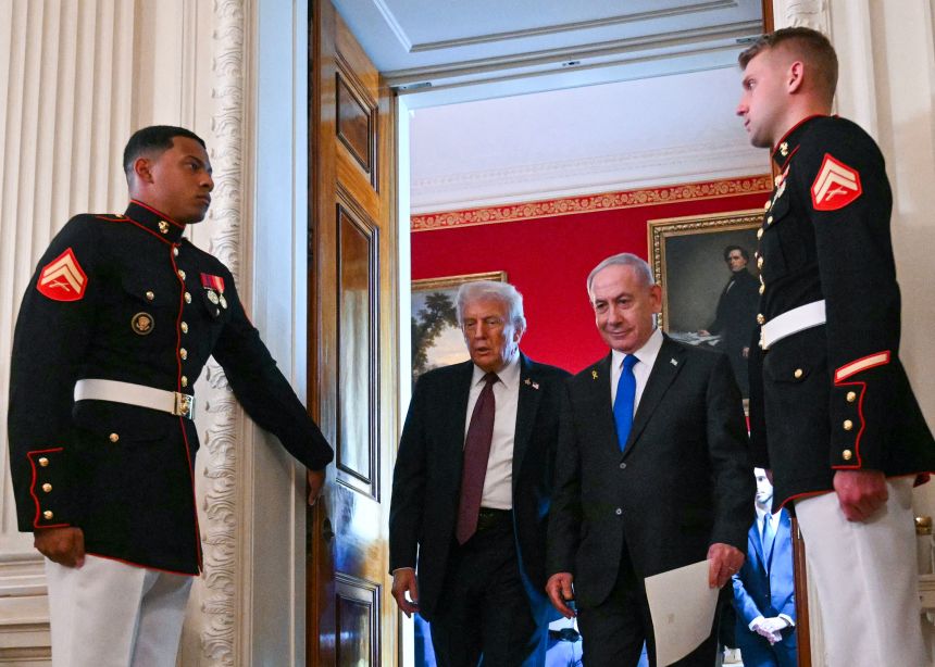 US President Donald Trump and Israeli Prime Minister Benjamin Netanyahu leave the State Dining Room of the White House after a press conference on Monday.