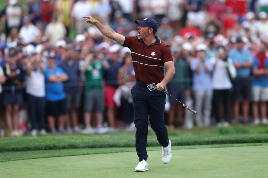 Rory McIlroy yells toward the crowd as he walks off the 17th hole on Saturday.