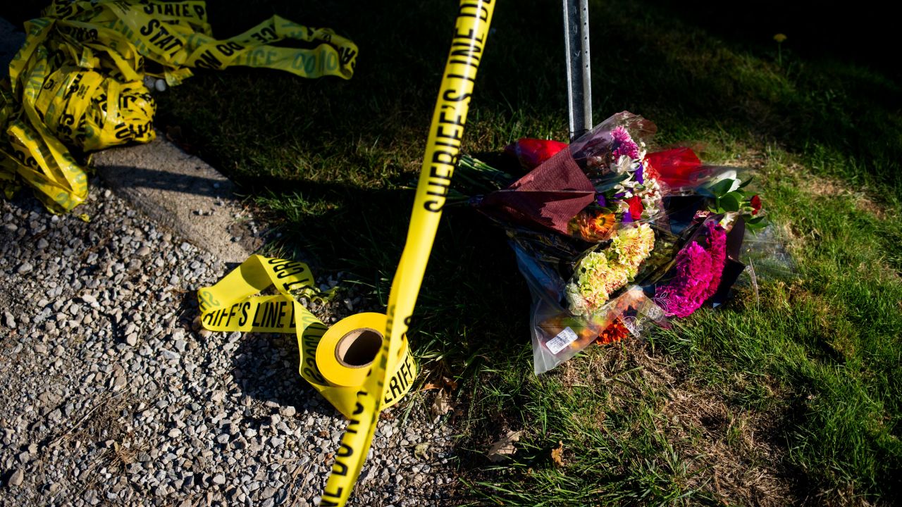 GRAND BLANC, MICHIGAN - SEPTEMBER 29: A makeshift memorial of flowers sits on the street next to police tape near the Church of Jesus Christ of Latter-day Saints Michigan following a shooting and fire at on September 29, 2025 in Grand Blanc, Michigan. The suspect crashed his vehicle into the church on the morning of September 28, started shooting and set the church on fire. At least four people were killed and eight wounded. The gunman was killed by police. (Photo by Emily Elconin/Getty Images)