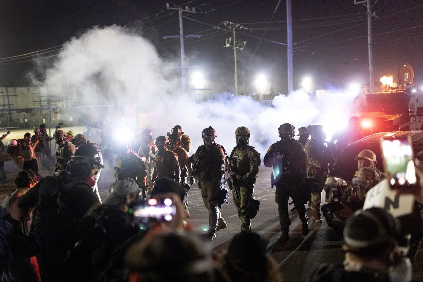 Federal law enforcement agents use a barrage of tear gas and pepper balls against protesters outside the ICE facility in Broadview, Illinois, on September 27.