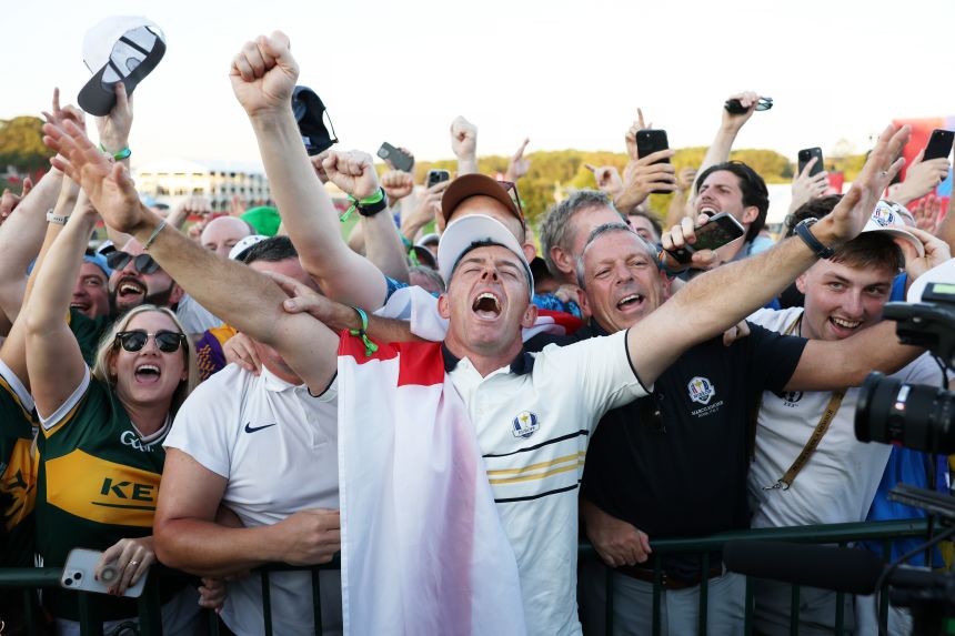McIlroy celebrates with fans after Team Europe's 15-13 win over Team USA.