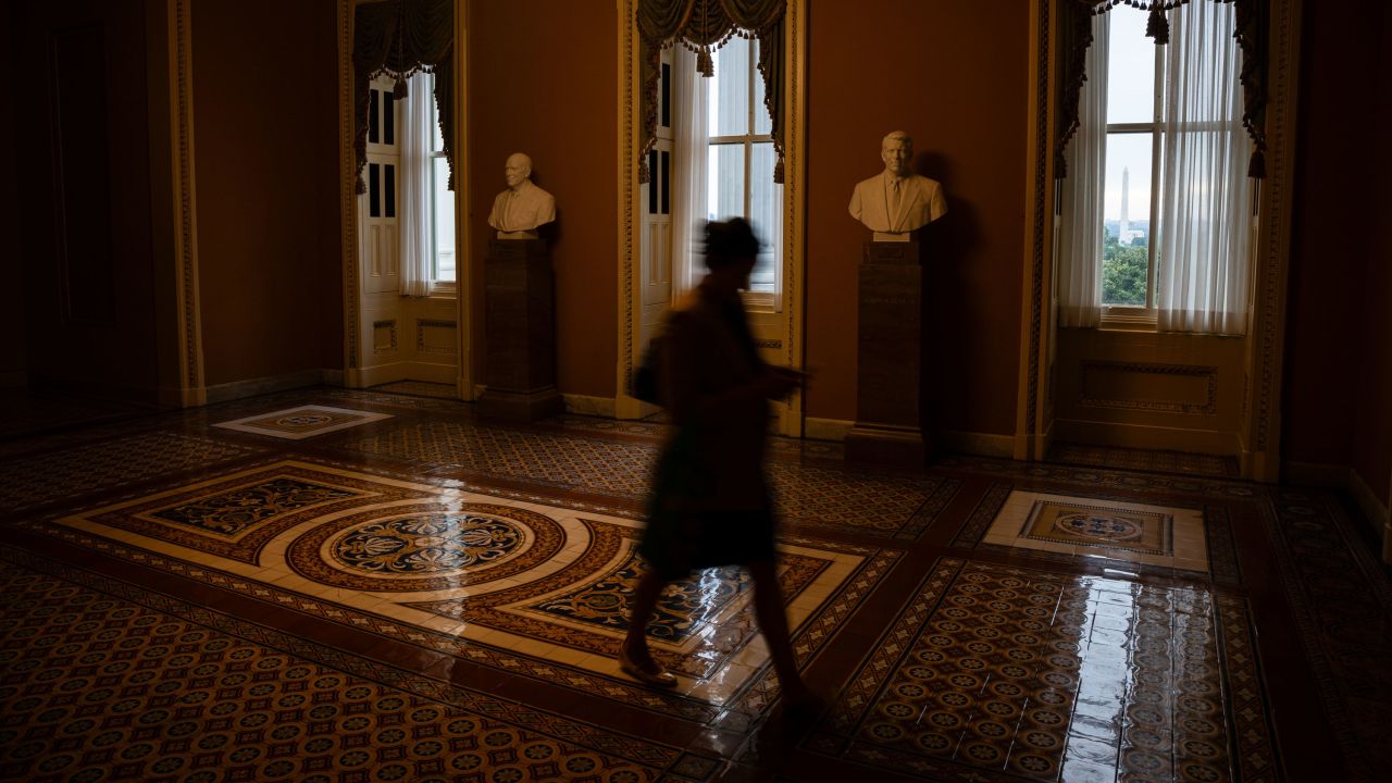 A worker walks through the US Capitol in Washington, DC, US, on Tuesday, Sept. 30, 2025. The US government hurtled toward a Wednesday shutdown as Democrats had the votes to block a Republican stopgap funding package that didn't address their demands, the latest sign that neither party was likely to fold in the final hours before a federal funding deadline. Photographer: Graeme Sloan/Bloomberg via Getty Images