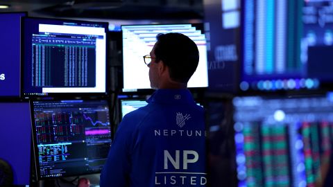 A trader works on the floor of the New York Stock Exchange (NYSE) at the opening bell on October 1, 2025, in New York City. Stocks were higher Wednesday as the US government officially entered a shutdown.