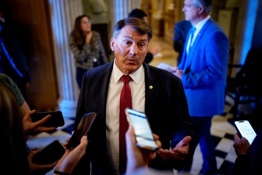 Sen. Mike Rounds speaks to reporters outside the Senate Chamber of the US Capitol, on Wednesday.