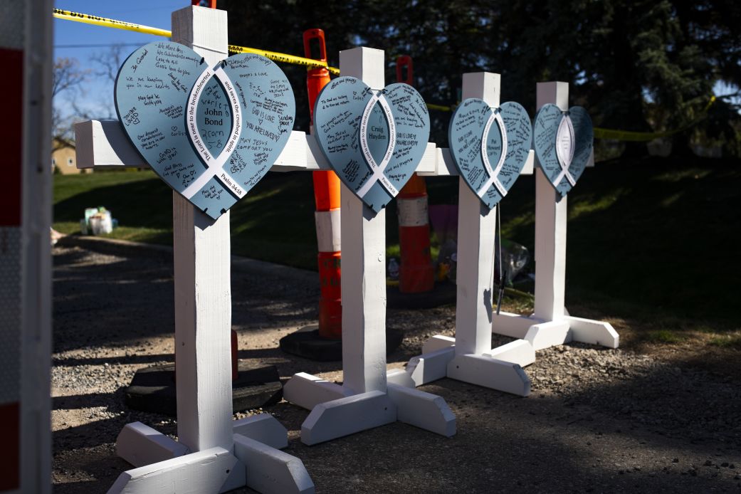 Memorials set up for victims near the site of a shooting and fire at the Church of Jesus Christ of Latter-day Saints on October 1, in Grand Blanc, Michigan.
