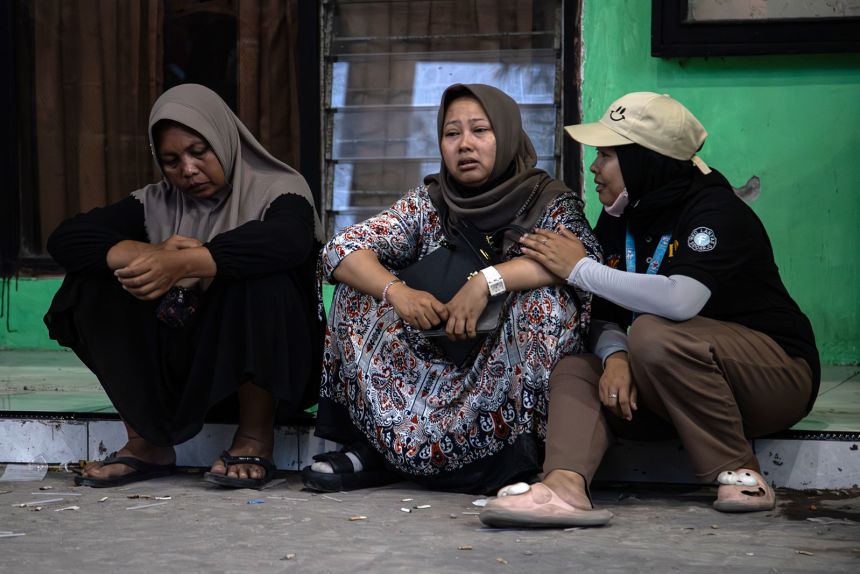 Relatives of students trapped in the collapsed building at the Al Khoziny Islamic Boarding School in Sidoarjo, East Java, Indonesia, on September 30, 2025.