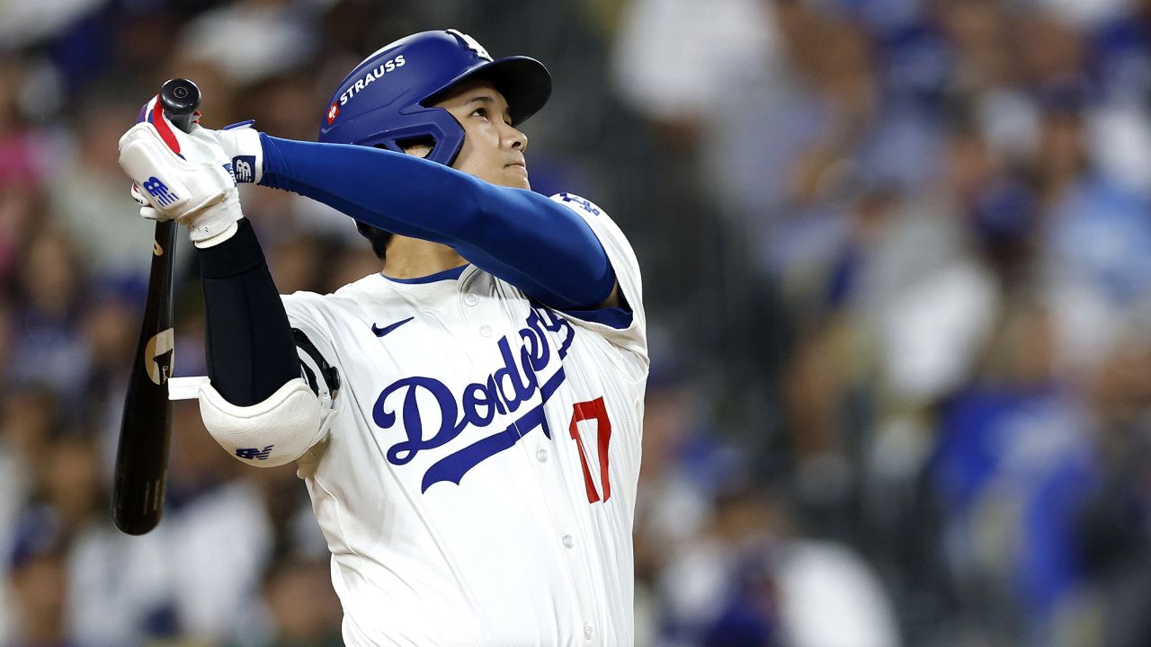 LOS ANGELES, CALIFORNIA - SEPTEMBER 30: Shohei Ohtani #17 of the Los Angeles Dodgers hits a two-run home run against the Cincinnati Reds during the sixth inning in game one of the National League Wild Card Series at Dodger Stadium on September 30, 2025 in Los Angeles, California.  (Photo by Ronald Martinez/Getty Images)