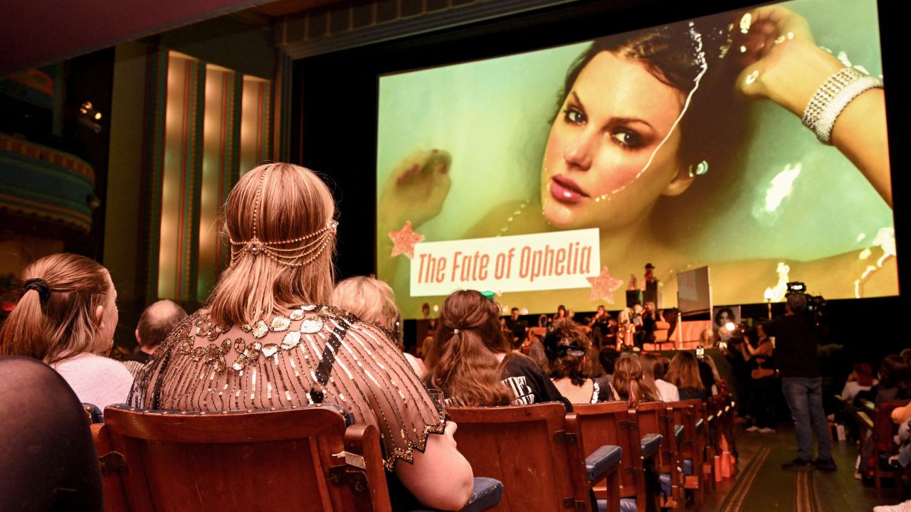 Taylor Swift fans listen to a song during a listening event for Swift's new album 'The Life of a Showgirl' at the Astor Theatre in Melbourne on October 3, 2025.