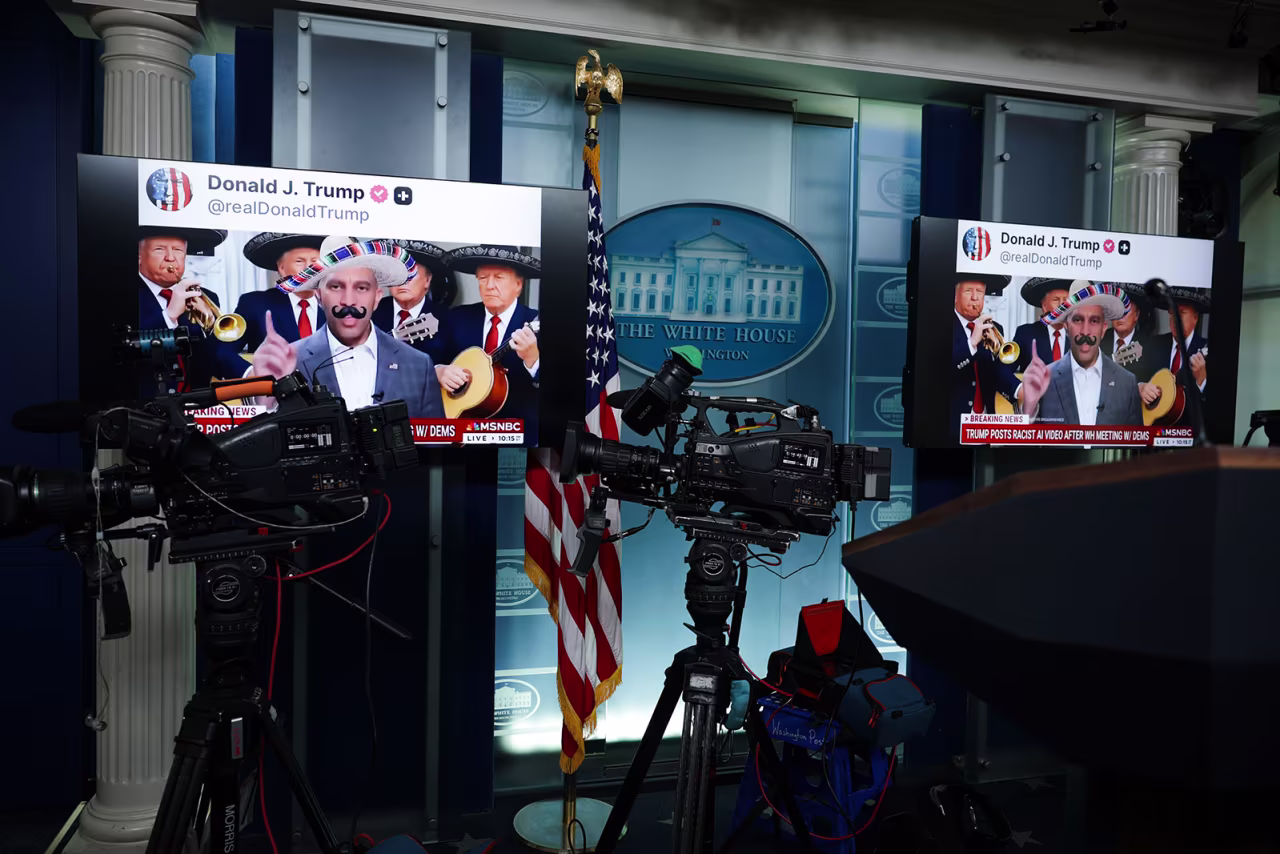 Screens display AI-modified videos of House Minority Leader Hakeem Jeffries  and Senate Minority Leader Chuck Schumer that were shared on social media by President Donald Trump in the Brady Press Briefing Room at the White House on Wednesday.