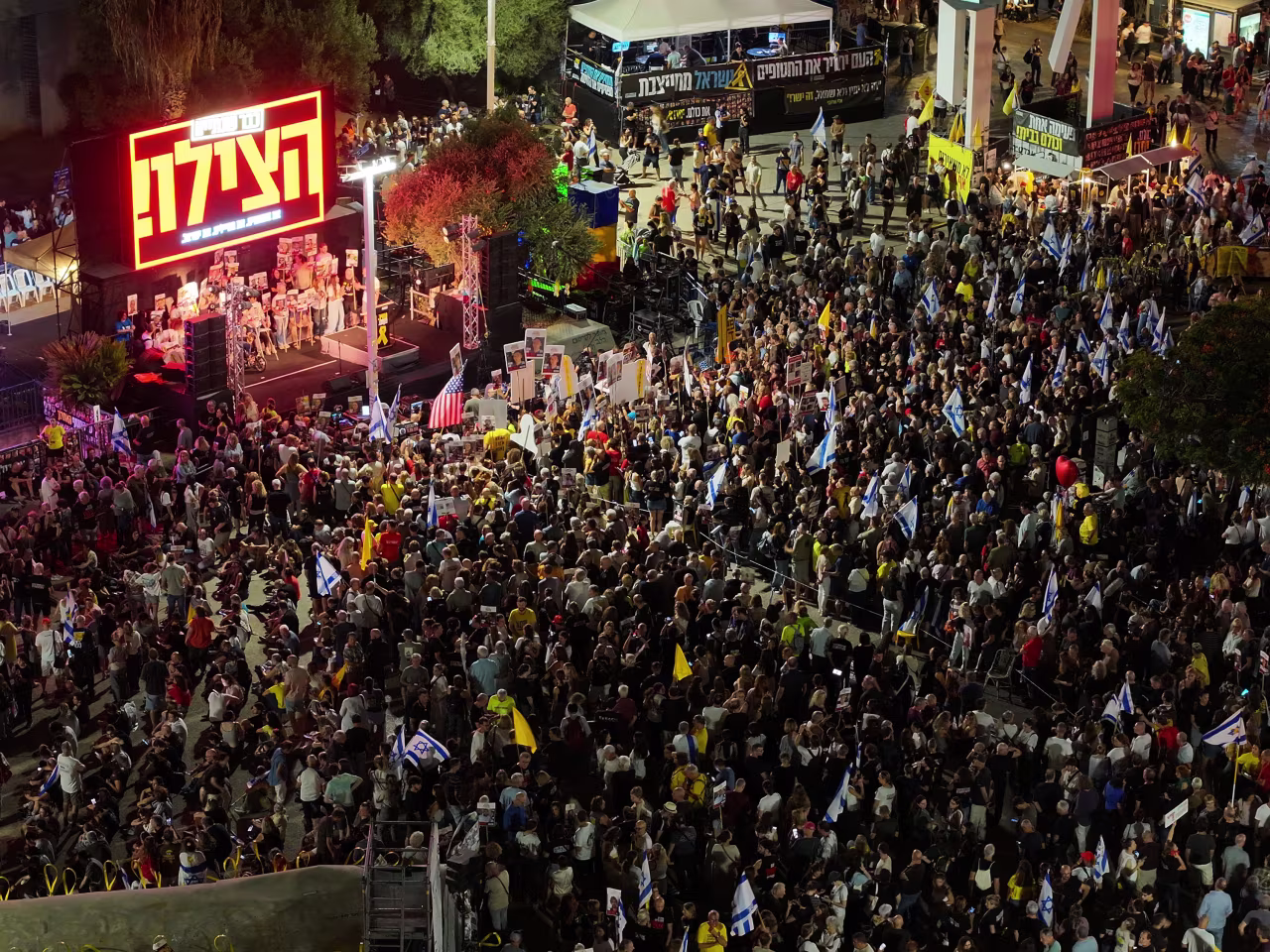 People gather to stage a protest demanding an end to the war in Gaza and the return of the hostages at Hostages Square in Tel Aviv on Saturday.