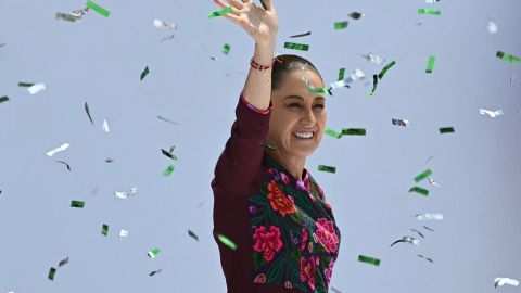 Mexico's President Claudia Sheinbaum waves to supporters upon arriving at a rally marking her first year in office, at Zocalo Square in Mexico City, on October 5, 2025 (Photo by Yuri CORTEZ / AFP) (Photo by YURI CORTEZ/AFP via Getty Images)          