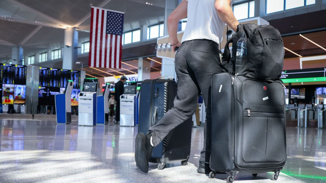 Travelers at Newark Liberty International Airport in Newark, New Jersey.