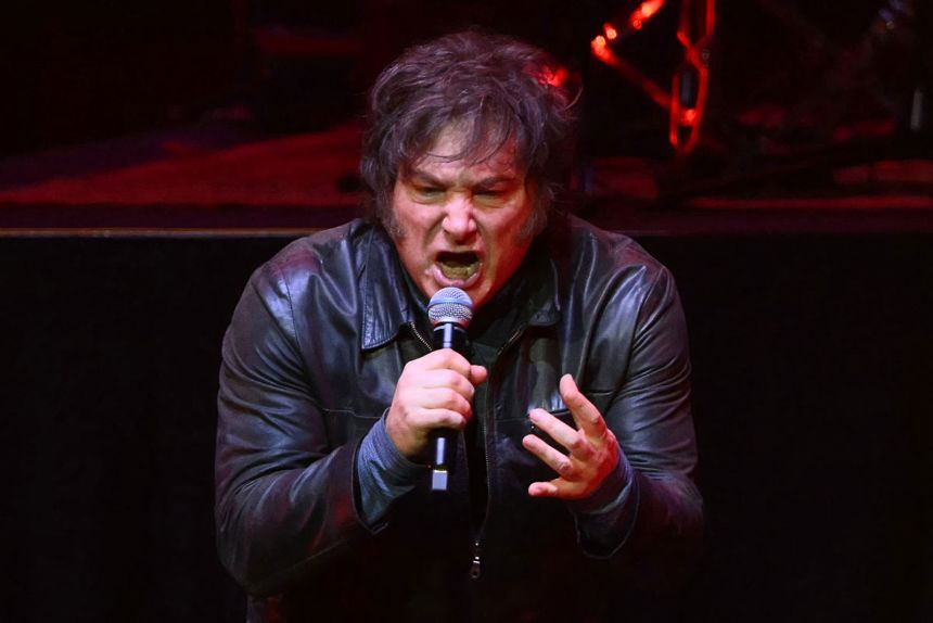 Argentina's President Javier Milei sings during the launch of his new book,