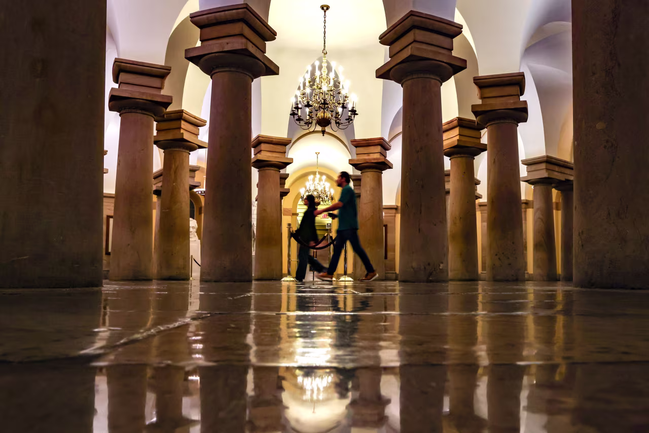 Workers walk through the crypt of the US Capitol on Wednesday.