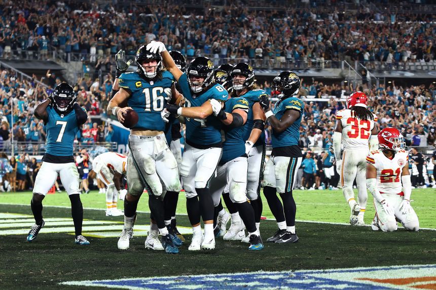 Lawrence (No. 16) celebrates with his teammates.