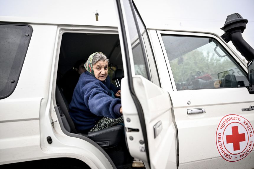 Antonina, 68, is evacuated by the Ukrainian Red Cross from the front-line village of Dobropillia, Zaporizhzhia region, Ukraine, on October 9.