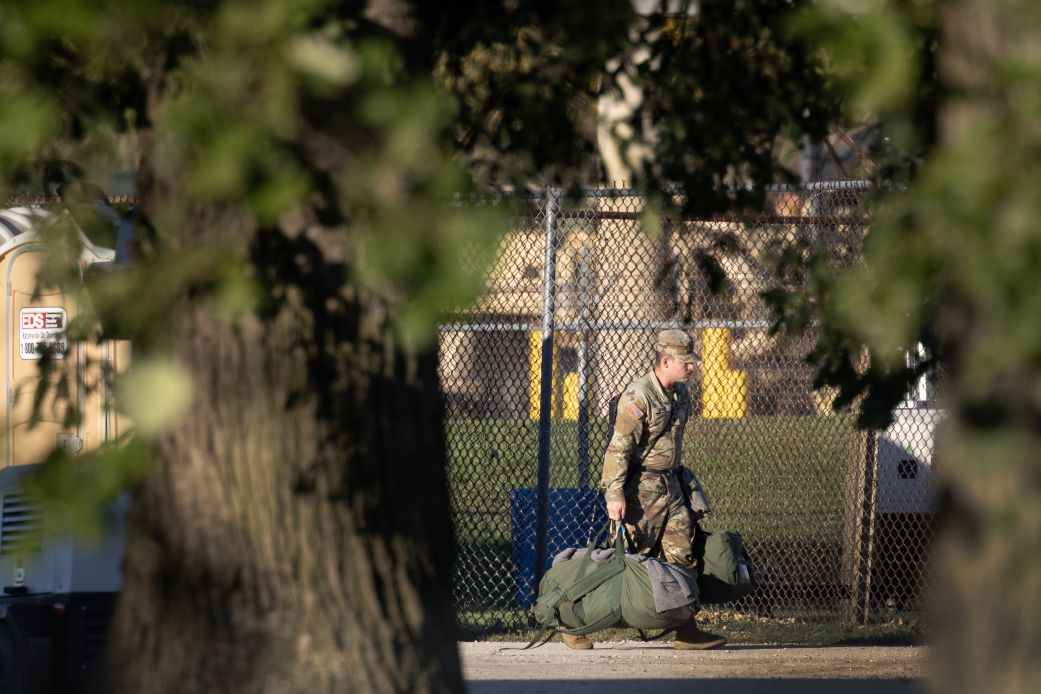 Members of the Texas National Guard arrive at an army reserve training facility on Tuesday in Elwood, Illinois.