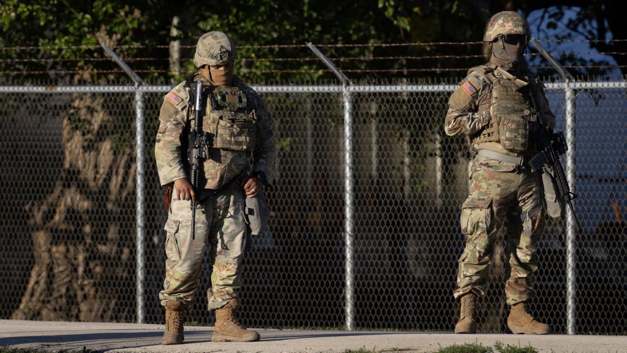 Members of the Texas National Guard stand guard at an army reserve training facility in Elwood, Illinois, on October 7.