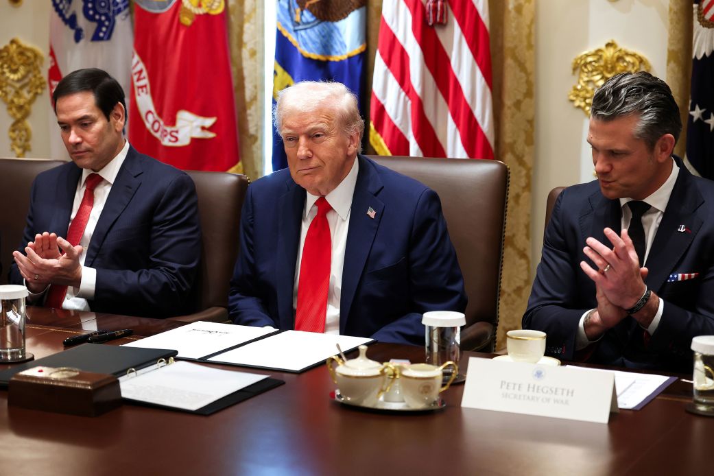 Secretary of State Marco Rubio and Defense Secretary Pete Hegseth clap for President Donald Trump during a Cabinet meeting at the White House on Thursday.