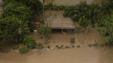 This aerial view taken during a Mexican Navy flyover shows a flooded house after heavy rains in Poza Rica, Veracruz state, Mexico on October 11, 2025. Floods caused by torrential rains have killed at least 41 people in Mexico in recent days and left behind a trail of destruction, the government said Saturday. (Photo by Hector Quintanar / AFP) (Photo by HECTOR QUINTANAR/AFP via Getty Images)          