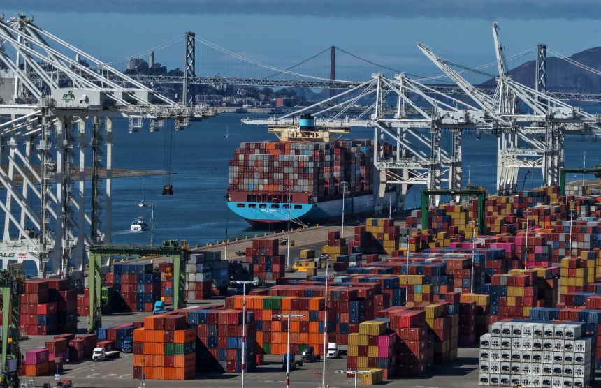 A container ship sits docked at the Port of Oakland on October 10 in Oakland, California.