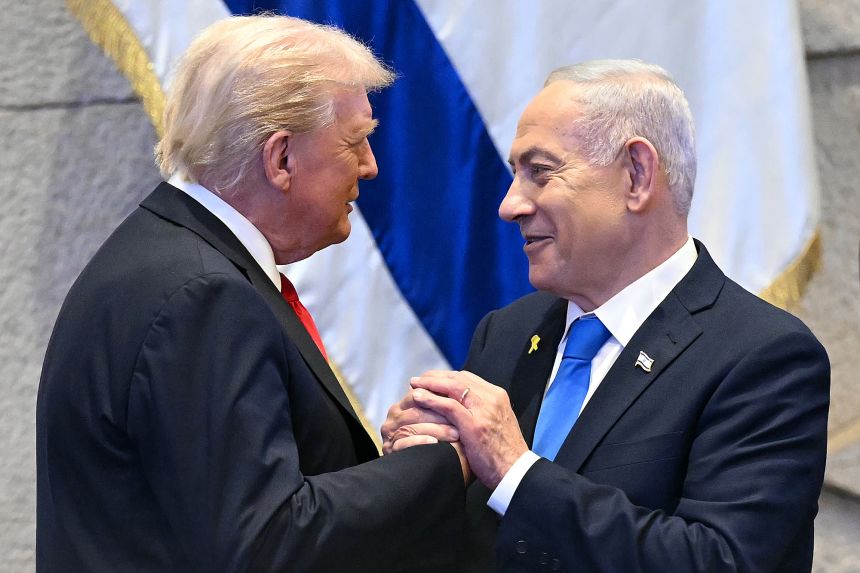Donald Trump holds hands and speaks with Israeli Prime Minister Benjamin Netanyahu at the Israeli parliament, the Knesset, in October.