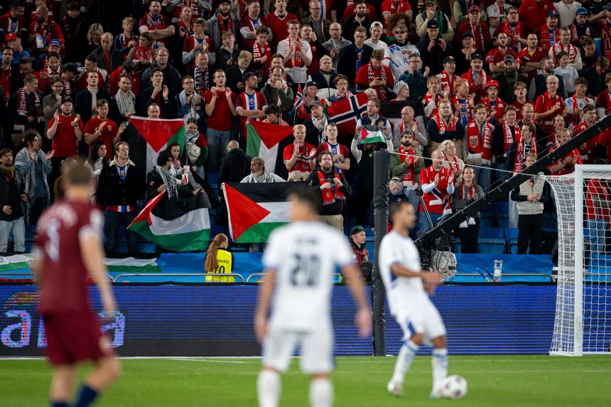 Fans held up Palestinian flags during the match.