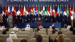 US President Donald Trump (C) delivers a statement during a summit on Gaza in Sharm el-Sheikh on October 13, 2025.