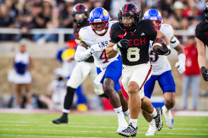 Texas Tech running back Cameron Dickey runs for a touchdown during the first half.