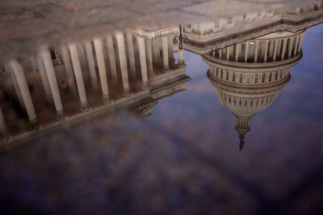 The Dome of the US Capitol Building is visible in reflection on Tuesday in Washington, DC.