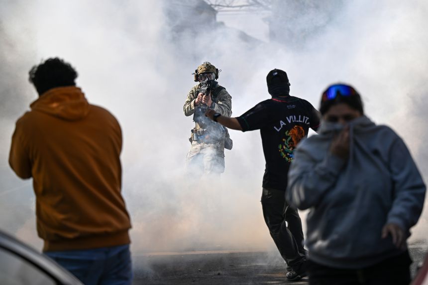Residents and protesters clash with federal agents in the East Side neighborhood on October 14 in Chicago.