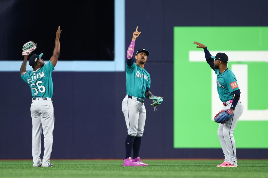 Seattle Mariners players celebrate after defeating the Toronto Blue Jays in Game 2.