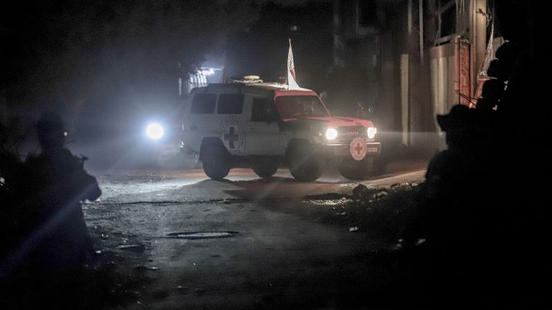 Vehicles of the International Committee of the Red Cross carry the bodies of hostages held in Gaza since the deadly October 7, 2023, attack, after their transfer by Hamas under a ceasefire and hostage-prisoner exchange agreement between Hamas and Israel, in Gaza City, Gaza Strip, on October 15, 2025. (Photo by Abood Abusalama / Middle East Images via AFP) (Photo by ABOOD ABUSALAMA/Middle East Images/AFP via Getty Images)          