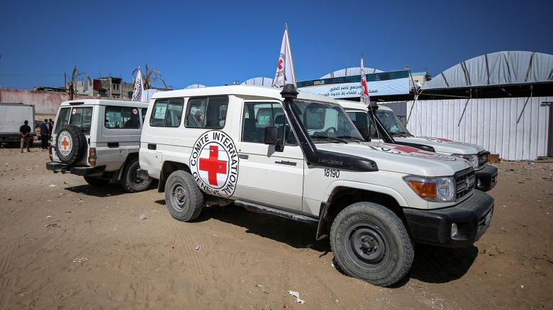 Red Crescent vehicles and refrigerated trucks park at the Nasser hospital in Khan Yunis, Gaza Strip, on October 16, 2025, after transporting the bodies of Palestinians that are in Israeli custody. Under the ceasefire deal brokered by the US president, Israel is to turn over the bodies of 15 Palestinians for every deceased Israeli returned. (Photo by Majdi Fathi/NurPhoto via Getty Images)