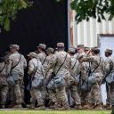 Members of the Texas National Guard arrive on October 7, at the Army Reserve Training Center in Elwood, Illinois.