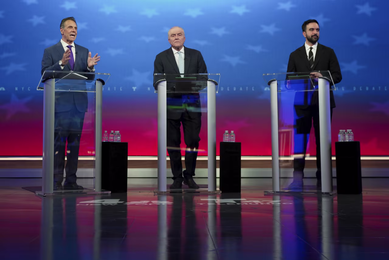 From left, independent candidate Andrew Cuomo, Republican candidate Curtis Sliwa and Democratic candidate Zohran Mamdani participate in a mayoral debate in New York on Thursday.