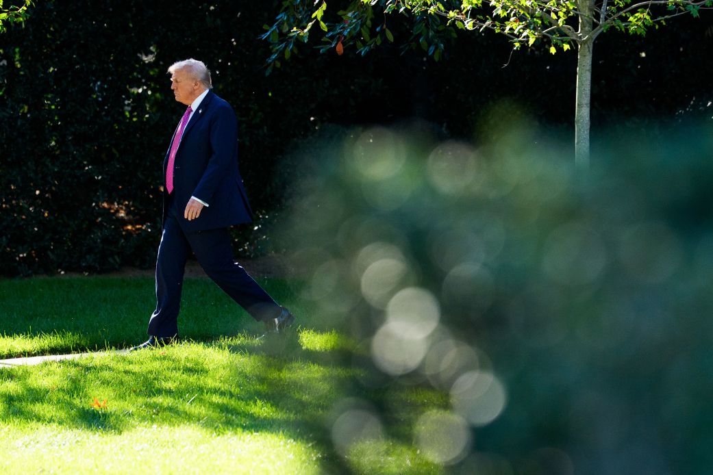 President Donald Trump walks on the South Lawn of the White House on Friday.