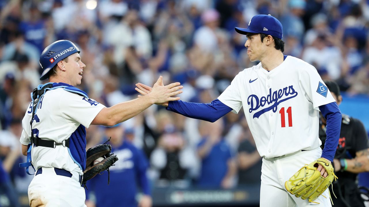 LOS ANGELES, CALIFORNIA - OCTOBER 16: Roki Sasaki #11 reacts with Will Smith #16 of the Los Angeles Dodgers after recording the final strike out against the Milwaukee Brewers in game three of the National League Championship Series at Dodger Stadium on October 16, 2025 in Los Angeles, California. (Photo by Sean M. Haffey/Getty Images)