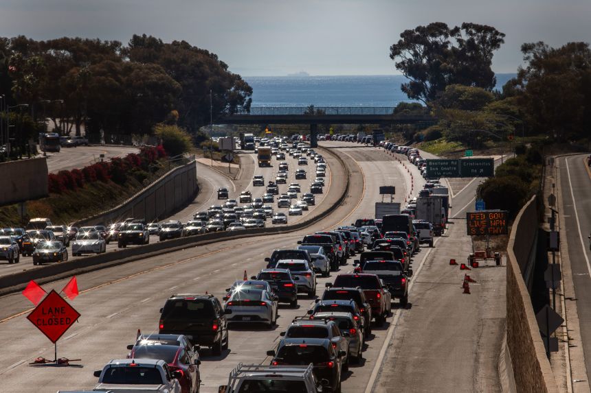 Signs alert motorists about the closure of a section of Interstate 5 ahead of the demonstration.