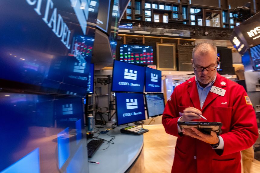 Traders work on the floor of the New York Stock Exchange on October 17.