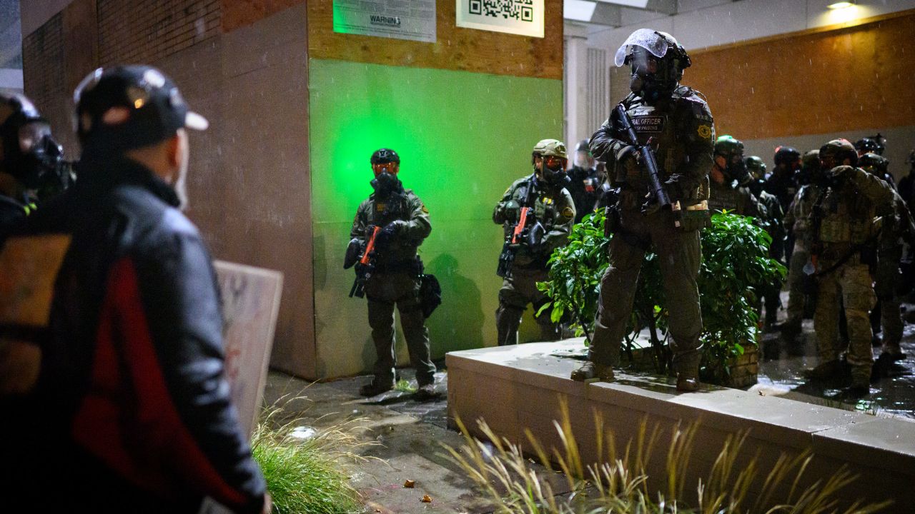 PORTLAND, OREGON - OCTOBER 18: Anti-I.C.E. protesters clash with federal agents at the U.S. Immigration and Customs Enforcement building on October 18, 2025 in Portland, Oregon. Organizers expect millions to participate in cities and towns across the nation for the second "No Kings" protest to denounce the Trump administration.  (Photo by Mathieu Lewis-Rolland/Getty Images)