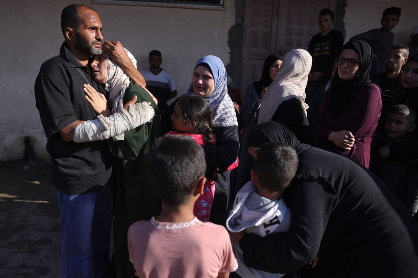 Friends and relatives mourn the death of a loved one outside Deir al-Balah's Shuhada al-Aqsa hospital on Sunday.
