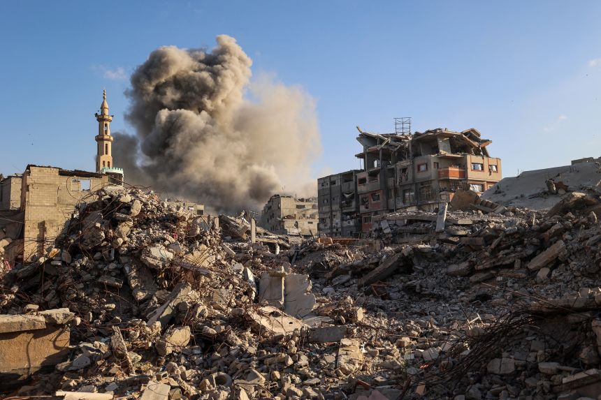 The aftermath of an Israeli strike in the Bureij camp for Palestinian refugees in the central Gaza Strip on Sunday.