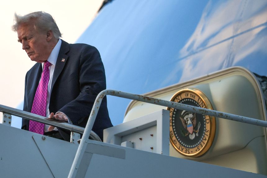 President Donald Trump walks down the steps of Air Force One after he landed at West Palm Beach International Airport in West Palm Beach, Florida, on October 17, 2025.