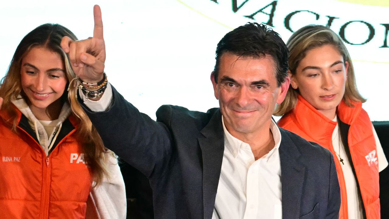 TOPSHOT - Bolivia's presidential candidate for the Christian Democratic Party (PDC), Rodrigo Paz, celebrates following the results of the run-off presidential election in La Paz, on October 19, 2025. Bolivians on Sunday elected pro-business center-right senator Paz as their new president, ending two decades of socialist rule that have left the South American nation deep in economic crisis. (Photo by MARTIN BERNETTI / AFP) (Photo by MARTIN BERNETTI/AFP via Getty Images)          