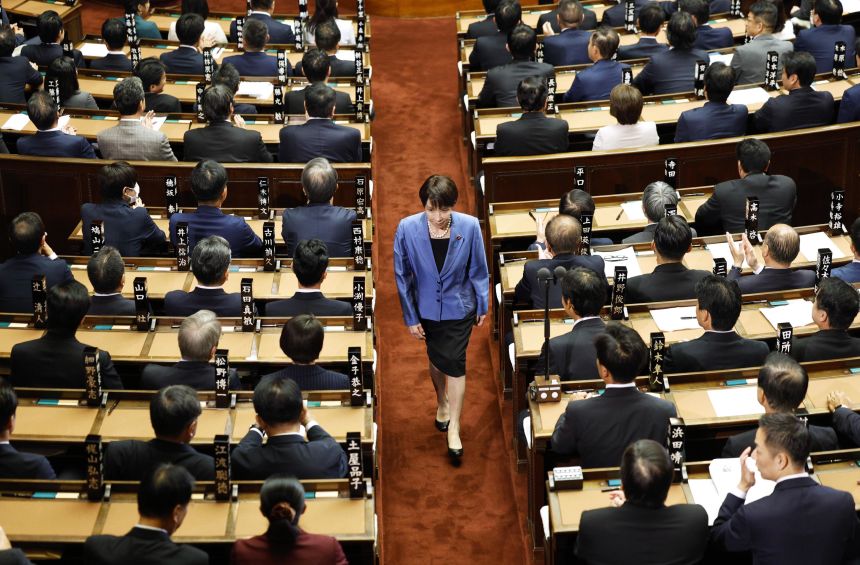 Sanae Takaichi, president of the ruling Liberal Democratic Party, walks after casting a vote in an election to choose Japan's next prime minister during a House of Representatives plenary session in Tokyo on Tuesday.