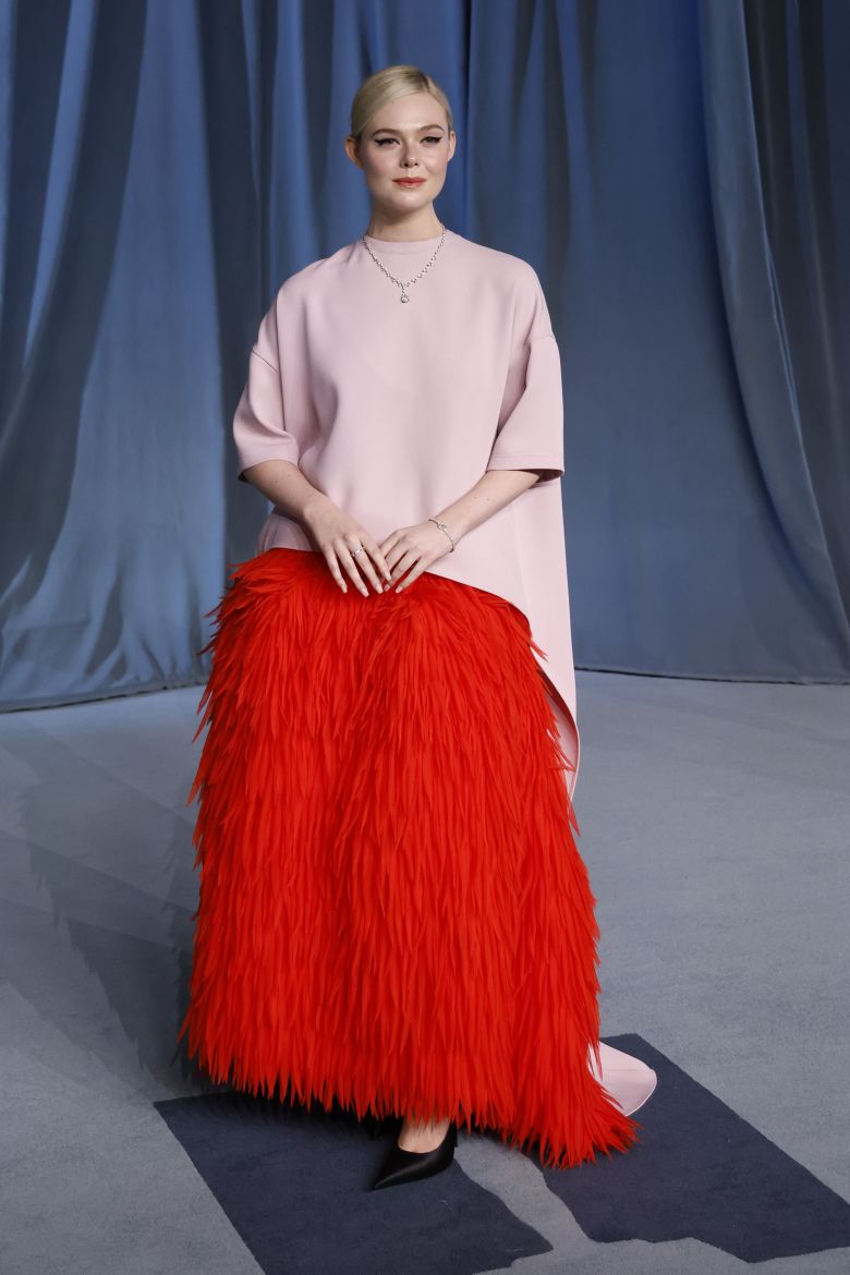 At the recent Academy Museum Gala in LA, Elle Fanning arrived in a head-to-toe Balenciaga look — the main event being her full feathered skirt.